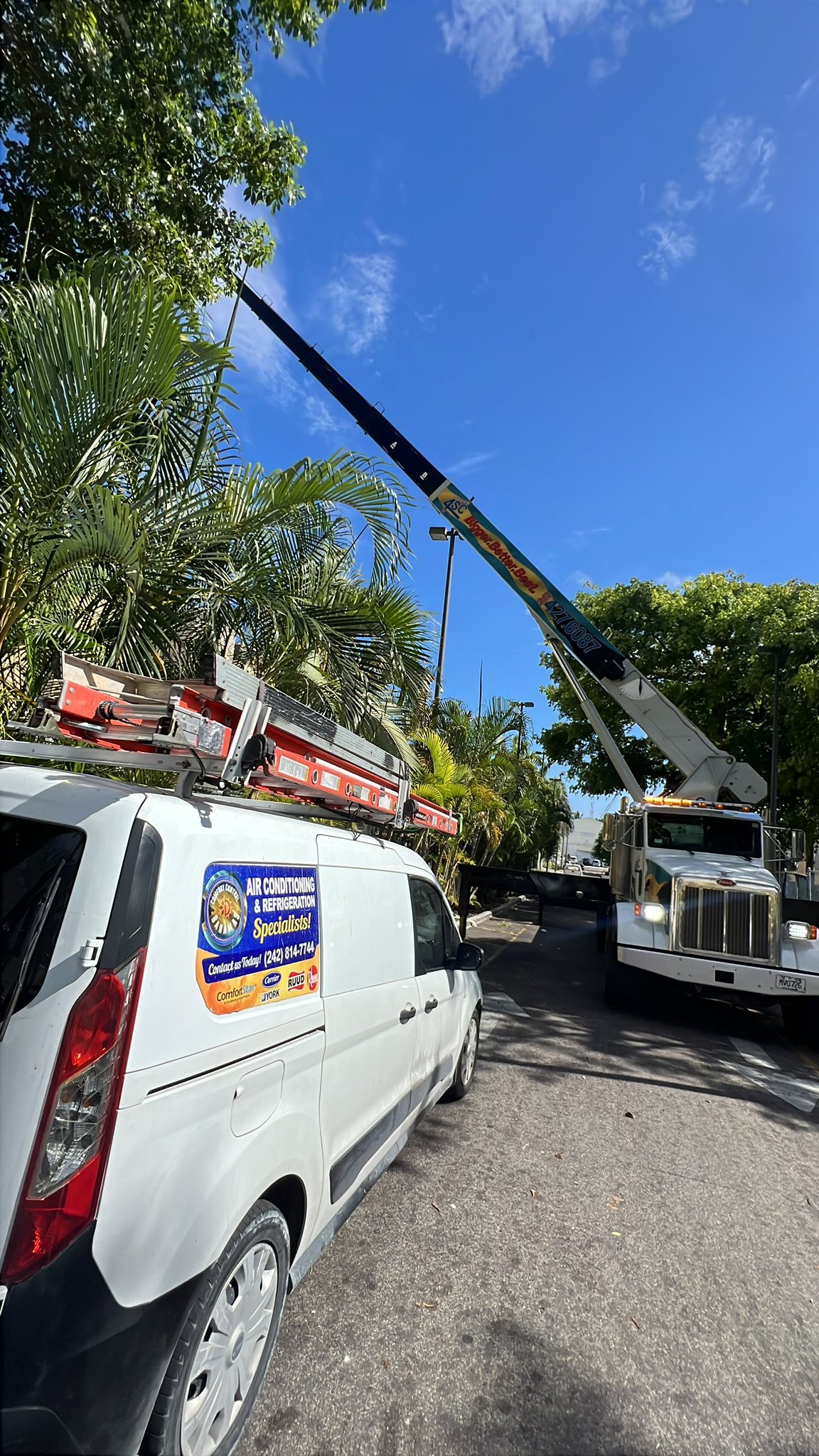 Work van and crane at large job site