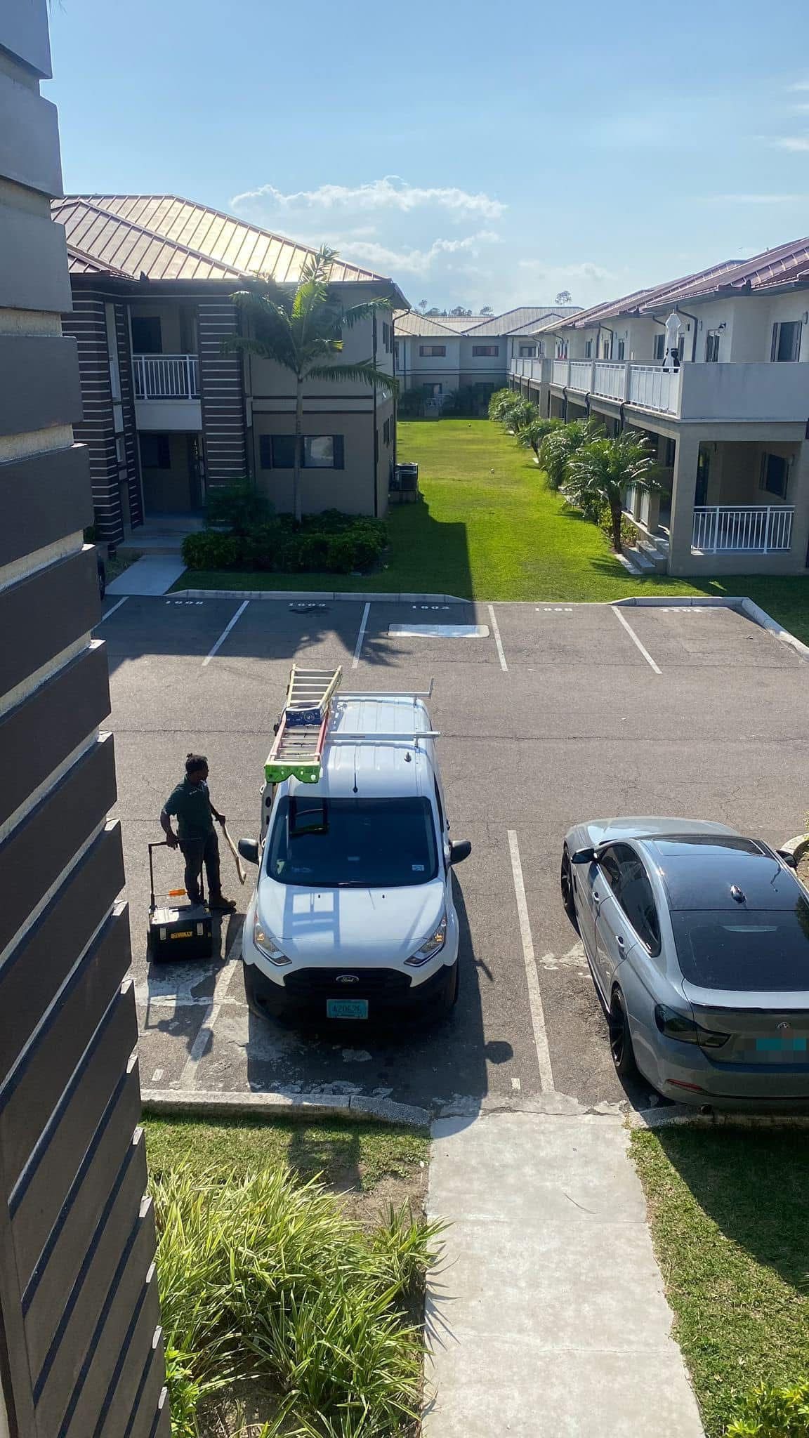 Bahamas AC Services van and technician at residential complex